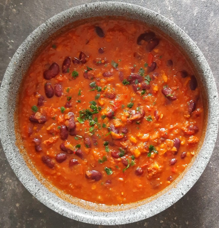 Homemade baked beans recipe in a serving dish.