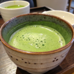 Beautiful matcha served in a ceramic cup on a wooden table