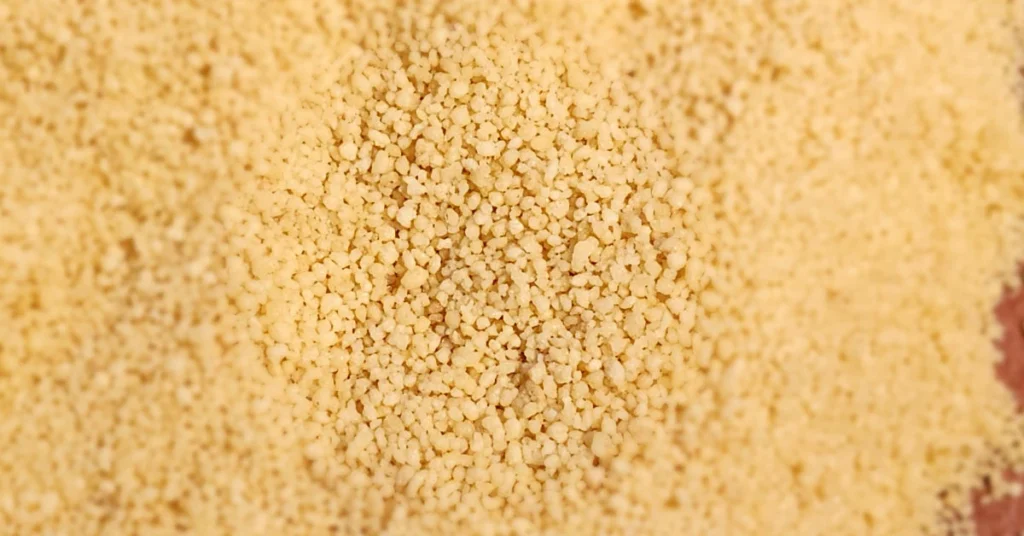 Steamed and fluffed couscous grains, separated for a light and airy texture.